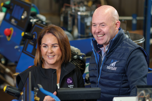 NatWest colleague with customer in a factory setting