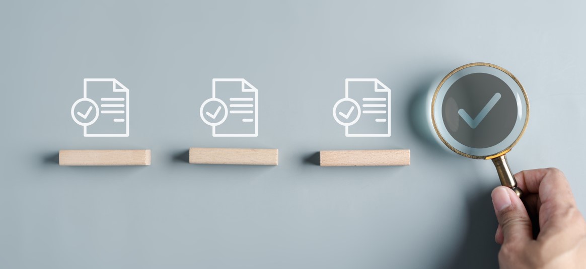 Three icons depicting ticked forms and a magnifying glass showing a tick icon. 
