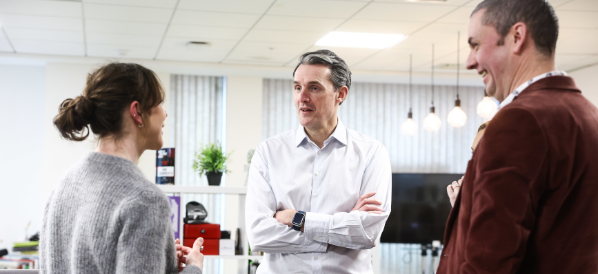 CEO Paul Thwaite with a customer and colleague