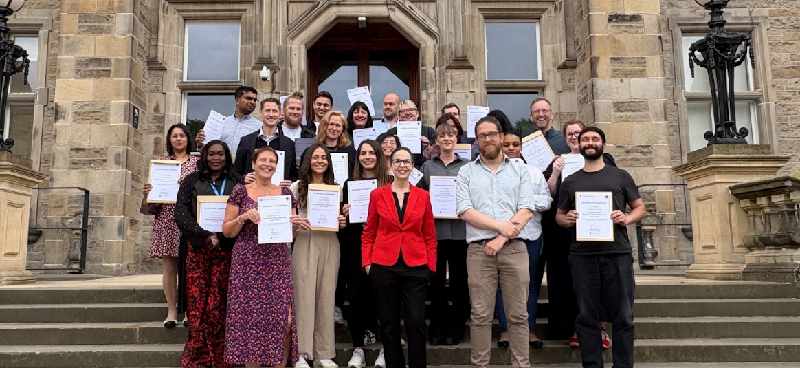 Image of the NatWest Group colleagues who are graduates of the AI and Data Ethics programme, outside the University of Edinburgh
