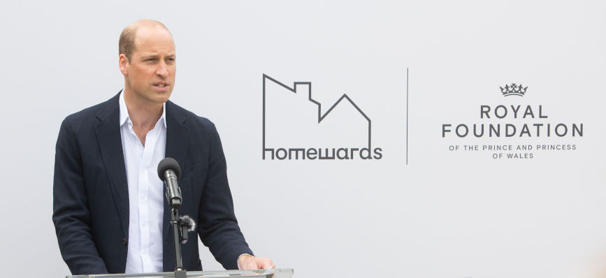 Prince William speaking at a lectern in front of Homewards and Royal Foundation backdrop