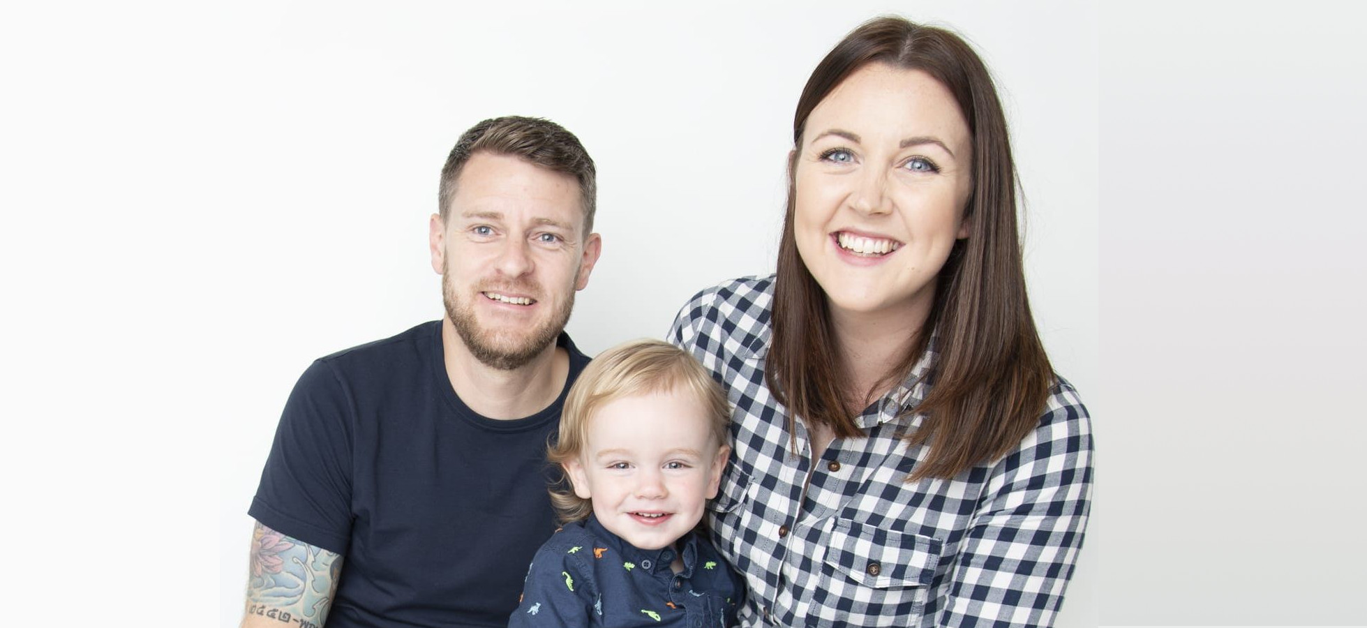 John, his partner Katie, and their son Theo