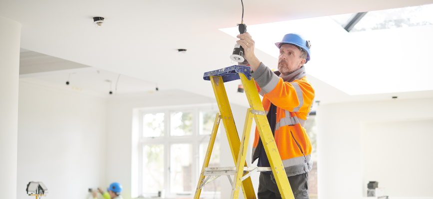 Electrician up a ladder 