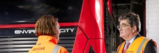 Two people wearing Zenobe high visibility jackets