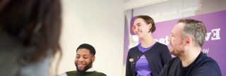 Three colleagues in branch having a discussion