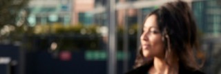 Colleague looking into the distance outside office