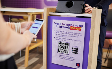 Phone scanning a QR code in branch
