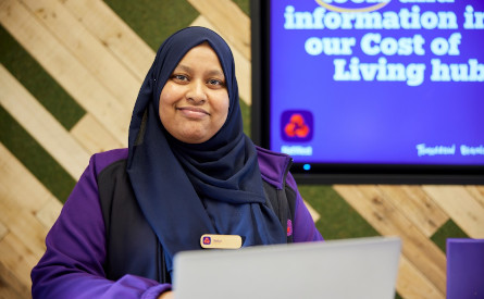 NatWest Group branch colleague smiling at work