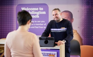 Branch staff serving a customer