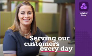 This image shows a NatWest Group colleague sitting down. The text on the image reads ‘Serving our customers every day’. 