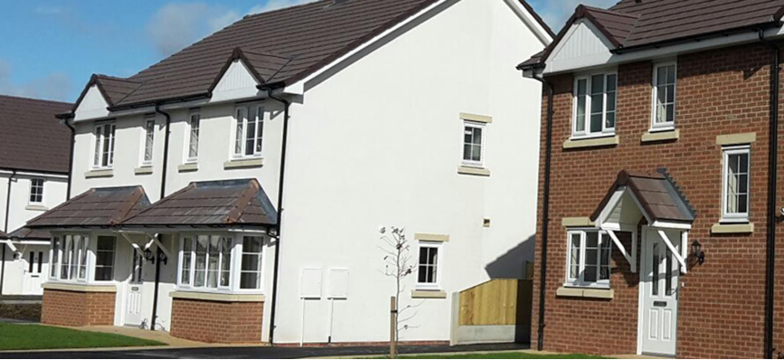Photograph of a white semi-detached house