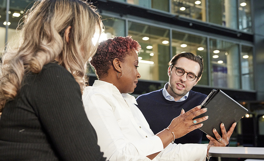 colleagues having a meeting with a digital tablet