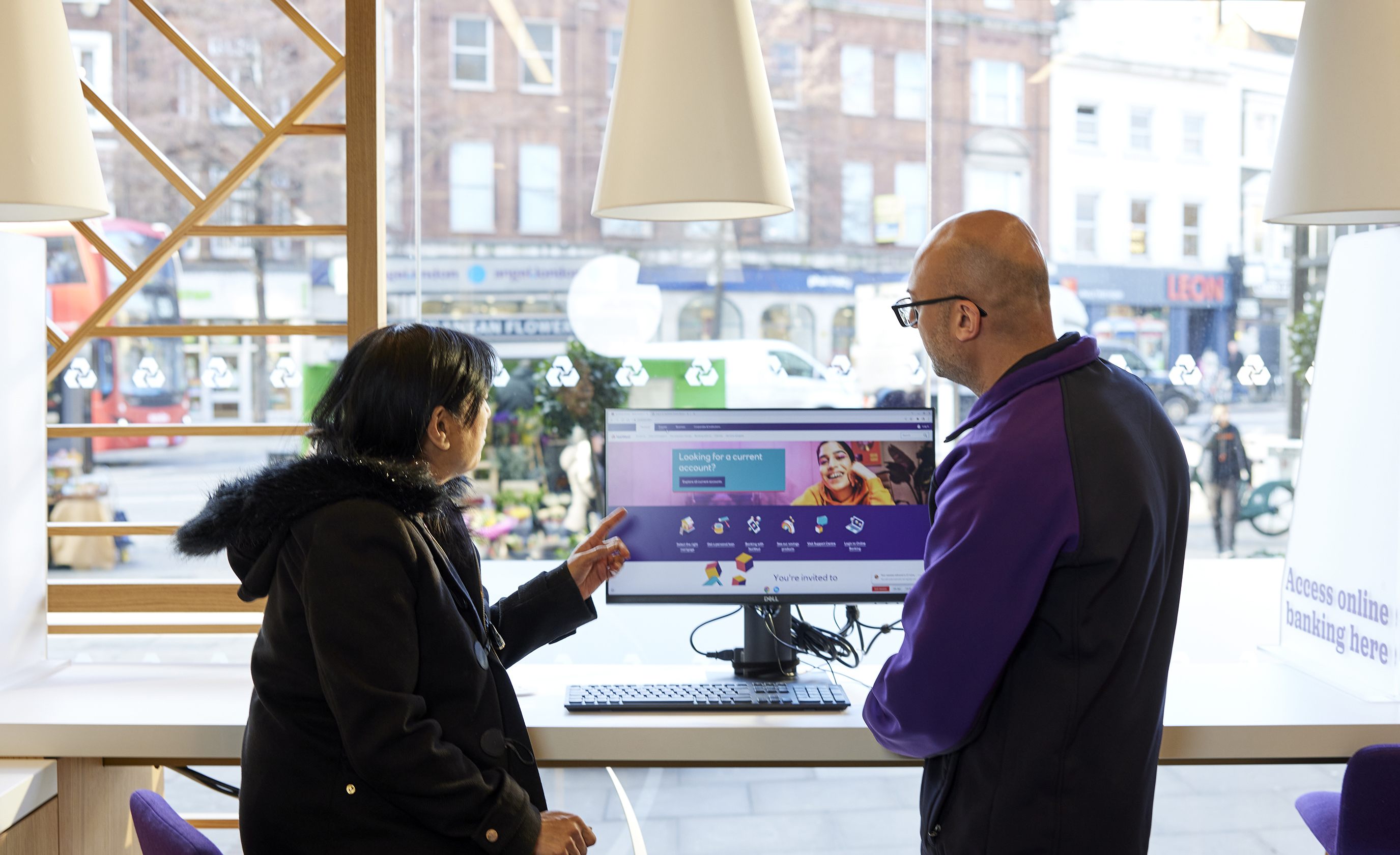 Colleague helping customer in branch