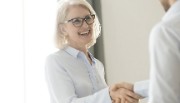 Picture of business woman in white shirt shaking hands