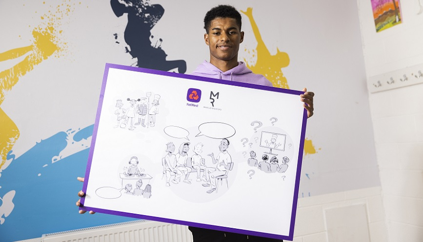 Marcus Rashford holding a poster with illustrations