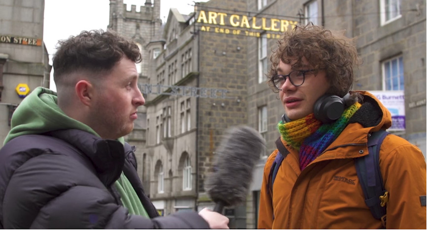 Paul Black speaking to someone on the street