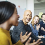 people smiling in an office workshop