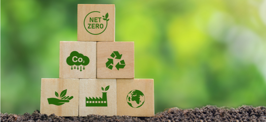 Building blocks showing climate icons placed on soil