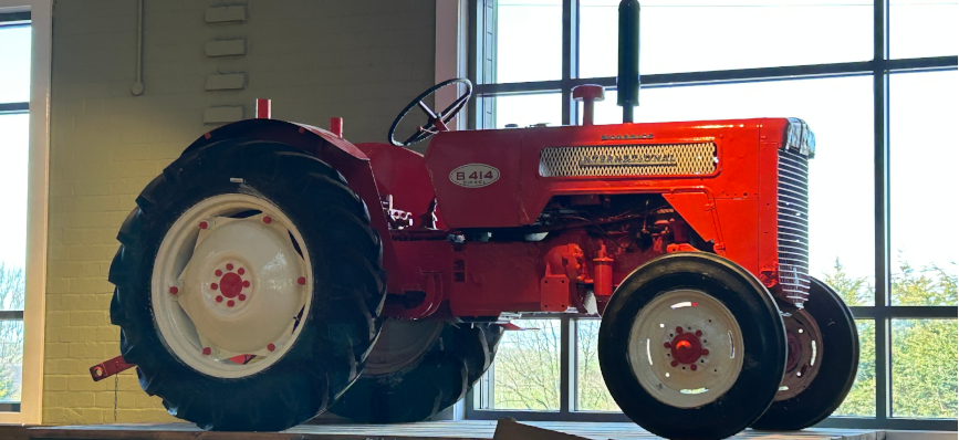 small red tractor like equipment on a worktop